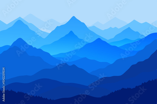Misty blue mountain peaks at sunrise with a cloud-filled valley