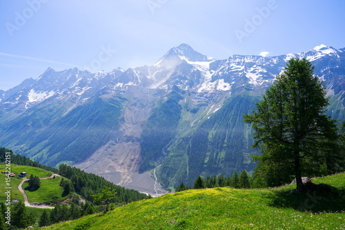 Fotografie Scenic view of rockfall with gravel and dust at Lötschental Valley in the Swiss Alps covering almost entire mountain village of Blatten