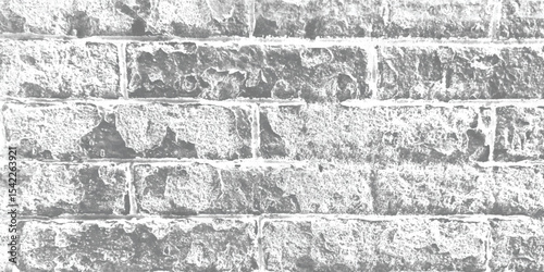 Rustic and rough-hewn stone wall, evoking a sense of ancient craftsmanship and natural beauty.
