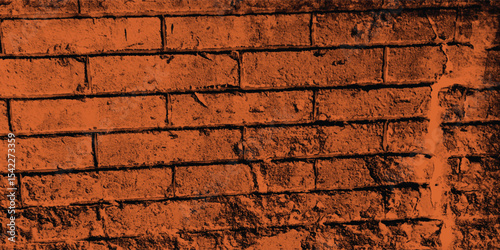 Vertical and horizontal lines of a textured reddish-brown wall, creating a strong sense of structure and orderly repetition with a dark side.
