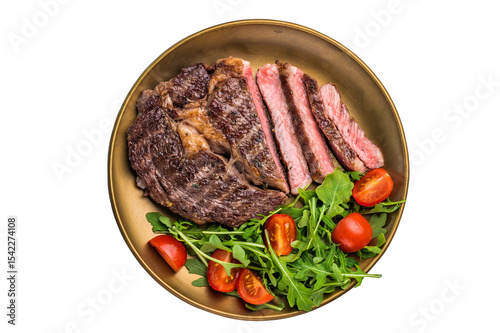 Obraz na plátně Rib eye steak with herbs in a plate with salad, grilled prime beef meat isolated
