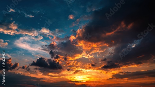 Vivid Sunset With Fiery Clouds Overhead and Soft Light Reflection on the Horizon Landscape Ideal for Nature Themes and Backgrounds