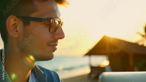 Young freelancer working with laptop while sitting on the beach of the tropical island. A young woman finds her flow at the beach, her laptop a vital tool in her tropical workspace.