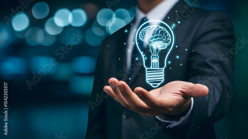 Businessman holding a brain lightbulb innovation concept