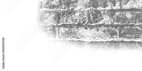 Grey-scale image of a building exterior, highlighting the intricate patterns and shadows cast on its textured walls.
