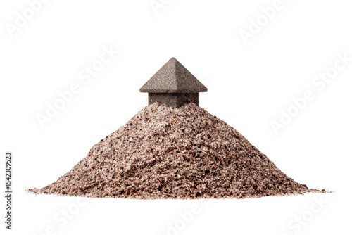 Small house made of sand sits atop mound of sand, symbolizing fragility and creativity. structure is simple yet intriguing, evoking sense of impermanence and artistic expression