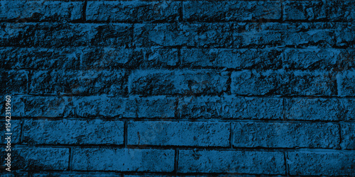 Close-up of a decorative concrete block wall in a deep blue, highlighting its geometric pattern and textural depth.
