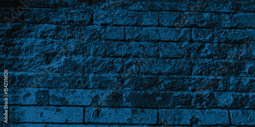 Close-up of a decorative concrete block wall in a deep blue, highlighting its geometric pattern and textural depth.
