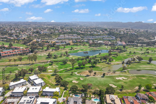 Aerial view of golf surrounded by villas and condos with golf in Carlsbad, North County San Diego, California, USA.