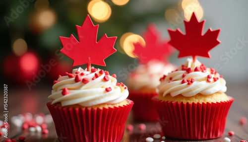 Festive red and white cupcakes with maple leaf toppers. Celebrating Canada Day.