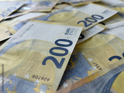Euro banknotes background close up, two hundred euro cash pile photo
