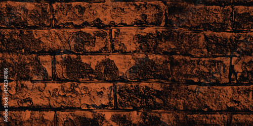 Rustic block wall illuminated by a warm, subdued light, revealing its intricate structure and time-worn imperfections with a dark fade.
