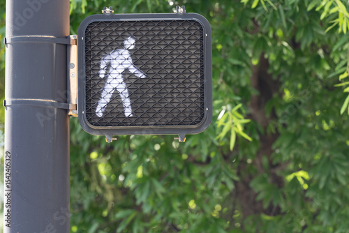 Illuminated led white lights person walk crosswalk sign signal with copy space