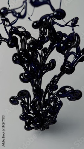 Vertical Swirl of black ink mixes clear water in glass. Fluid motion shapes textures. Creativity transformation. Liquid form. Experiment with paint and liquid. White background.