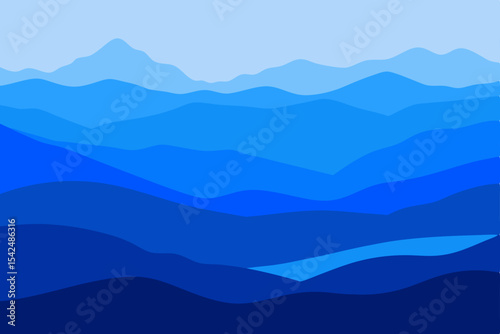 Mist-kissed peaks pierce the blue morning sky, revealing a serene mountain landscape veiled in fog