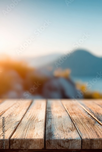 wooden platform with mountain view, blurred scenic alpine landscape with sunlight and distant peaks, bokeh depth, photo mockup for design and product demonstration