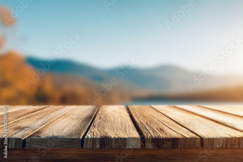 wooden platform with mountain view, blurred scenic alpine landscape with sunlight and distant peaks, bokeh depth, photo mockup for design and product demonstration