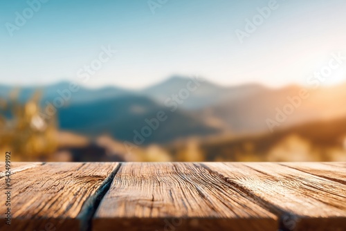 wooden platform with mountain view, blurred scenic alpine landscape with sunlight and distant peaks, bokeh depth, photo mockup for design and product demonstration