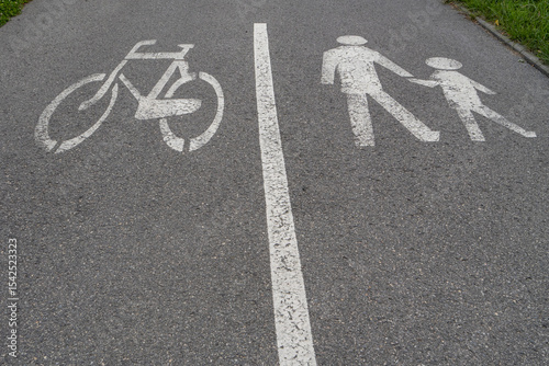 Fotografi Bike and pedestrian lane symbol on asphalt