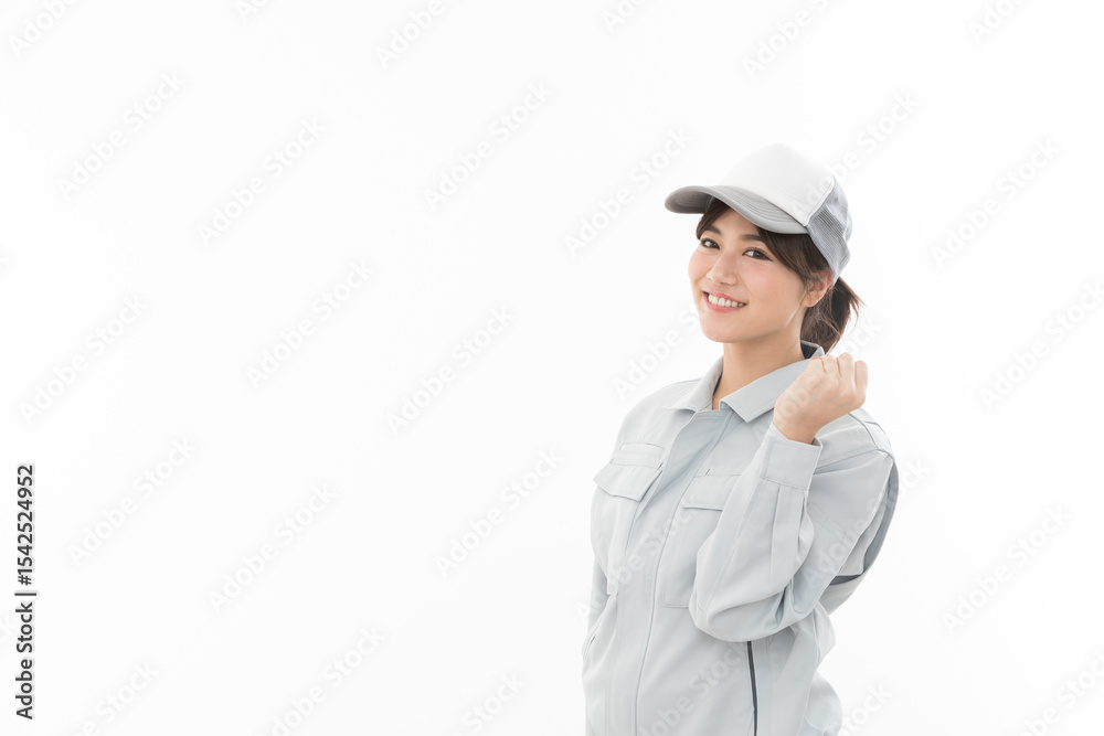 若い女性 作業着 ガッツポーズ 若い女性 作業着 ガッツポーズ