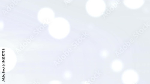 Blurry white lights on a light blue background.
