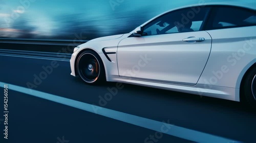 White sports car driving on a highway during the sunset with motion blur effect
