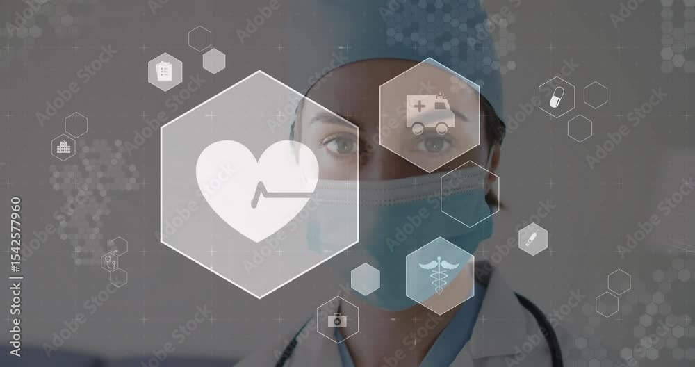 Medical professional in hospital analyzing medical icons fading in diagnosing patient