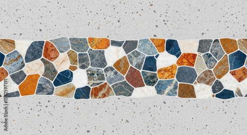 A close up of a decorative tile design with colorful stones and a speckled background pattern texture