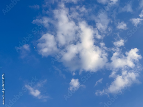 Deep Blue Sky with Puffy White Clouds Scattered Across Heaven