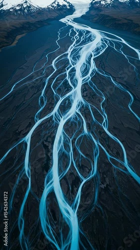 Aerial View of Glacial River System with Unique Patterns and Vibrant Colors in Icelandic Landscape