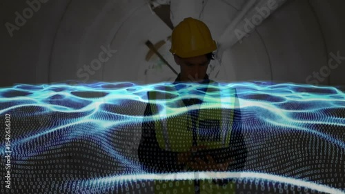 Construction inspector tapping smartphone and monitoring data wave then scanning tunnel