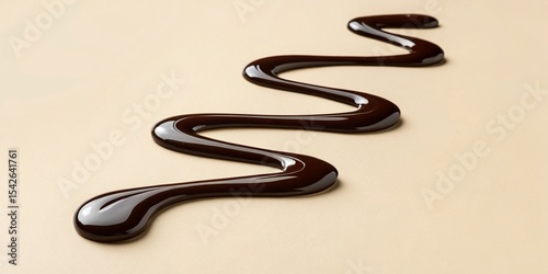 Smooth licorice extract elegantly flows on a neutral beige surface, showcasing a minimal luxury aesthetic in this captivating image.