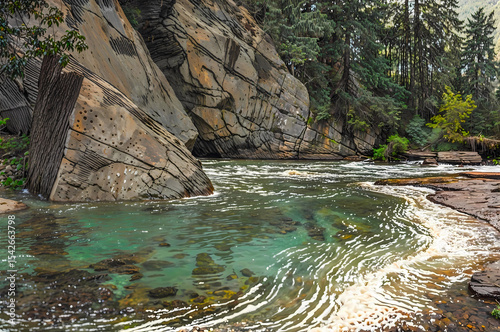 shallow placid creek in valley under mountains painting illustration