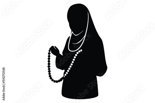 Young woman in hijab holding tasbih prayer beads