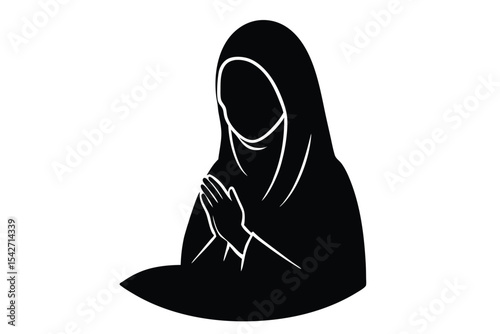 Young woman in hijab praying at sunset
