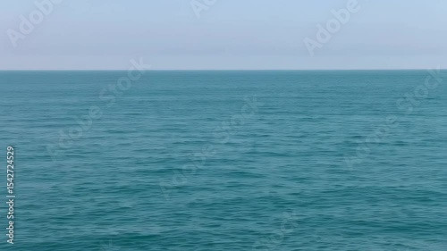 Wallpaper Mural Serene Turquoise Ocean Surface Ripples Gently Under a Soft Sky, Calm Nature Scene Torontodigital.ca