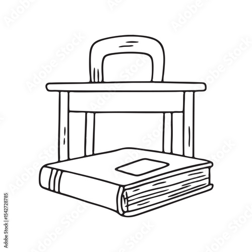 A book placed beneath a school desk
