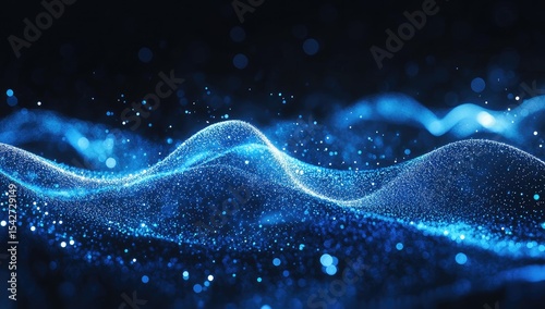 Abstract digital wave of light.  Blue particles form a flowing, wavy pattern against a dark background.  Specks of light accentuate the design