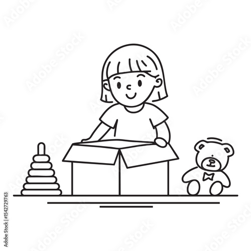 A child seated on the floor unboxing a toy
