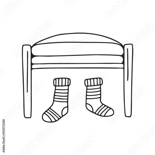 A pair of socks under a bed