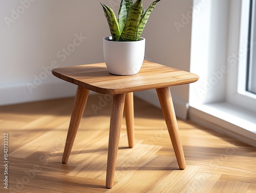 A stylish booster placed under an elegant wooden side table
