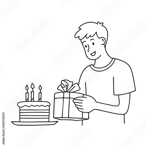 A gift being unboxed beside a birthday cake