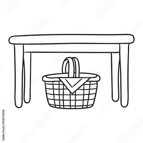 A picnic basket stored under a table
