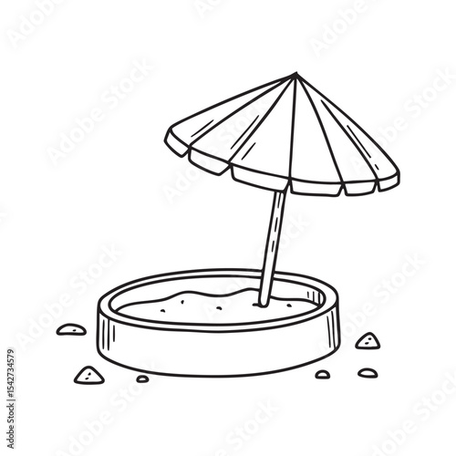 A tilted umbrella table next to a sandbox with scattered sand