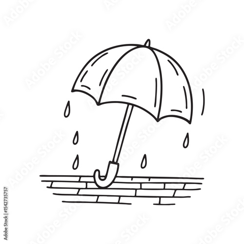 A rain soaked umbrella left open on the balcony floor