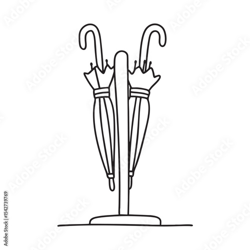 Folded umbrellas stored in a holder by the main entrance