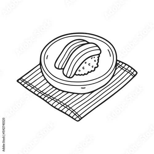 Unagi arranged on a table next to a bamboo placemat