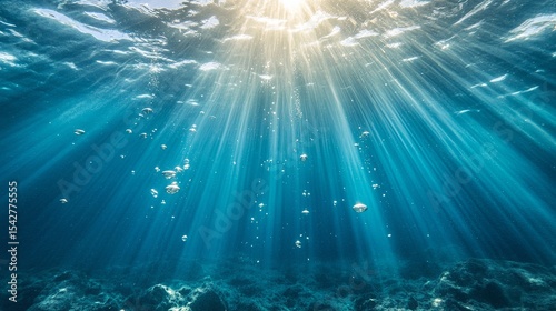 Magical deep underwater scene with soft glowing light rays, rising bubbles, and a calm serene atmosphere in crystal clear blue ocean depths for tranquil aquatic backgrounds

