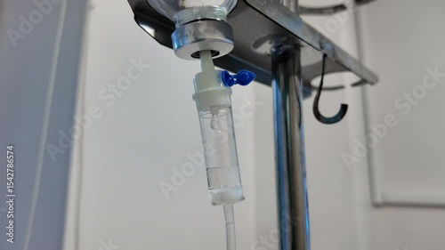 Close up of medical intravenous drip against hospital background