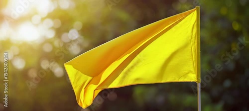 Yellow flag with sunlight. Generative video AI technology.	
